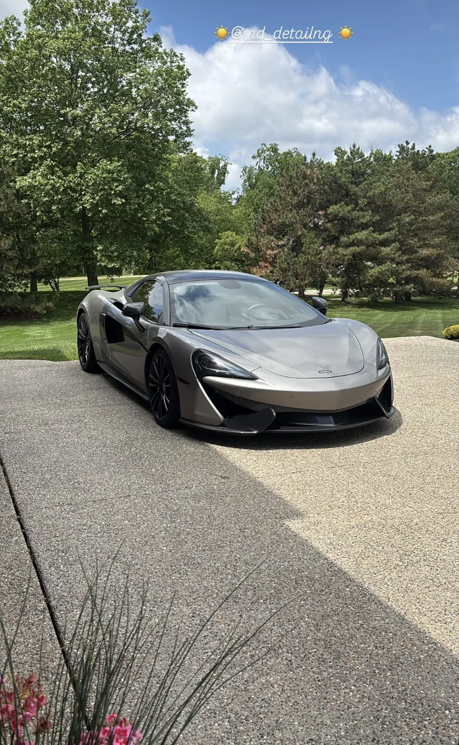 McLaren after a detail in a client's driveway